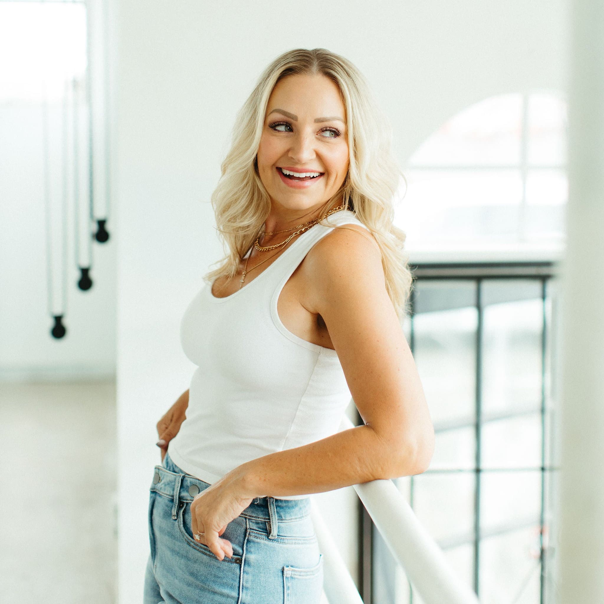 Amber smiling in white top