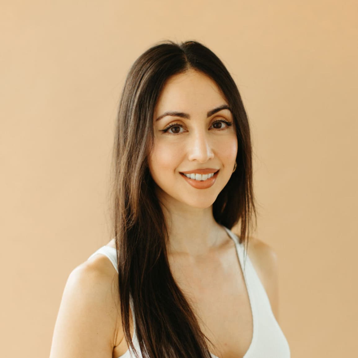 Theresa smiling in white top